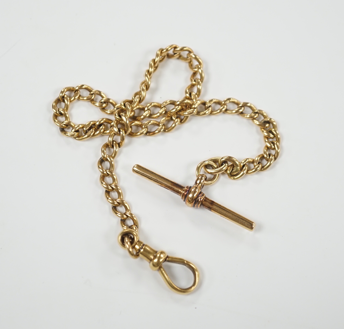 An 18ct gold curb link albert, 28cm